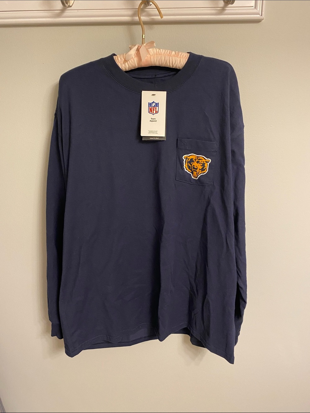 NFL Navy Long Sleeve Pocket Tee with Gold Bear Patch on pocket.